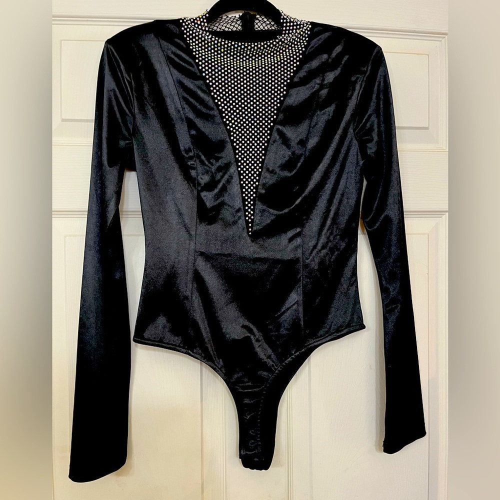 The Sang, size Large bodysuit. New with tags. Never worn.